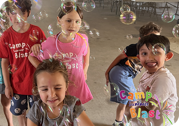 primary-summer-camp-kids-blowing-bubbles